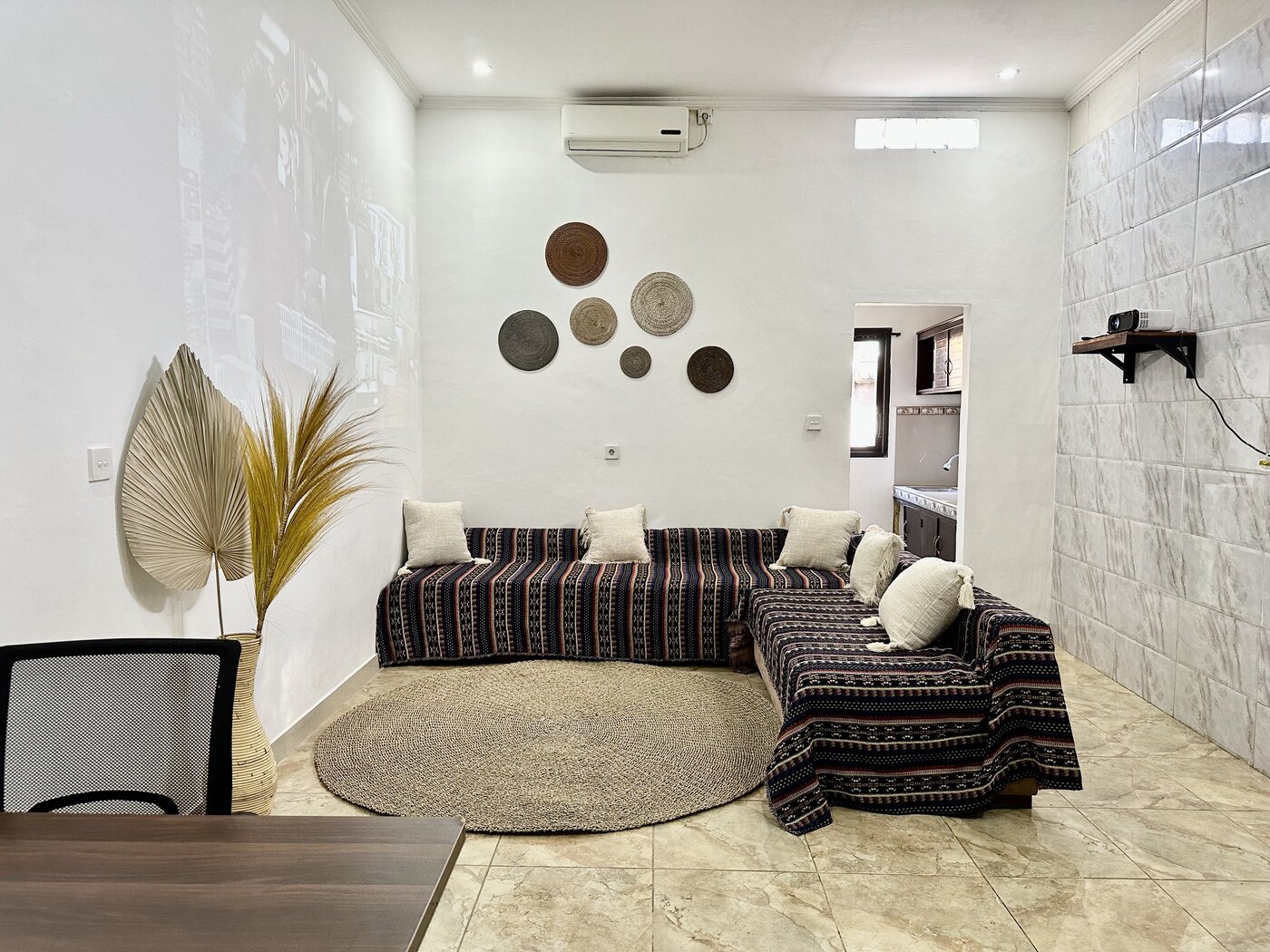 Former bedroom used as a makeshift lounge, before